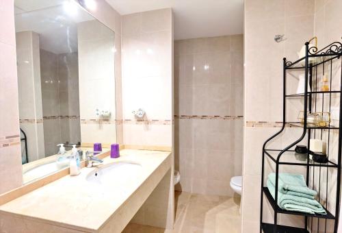 Koupelna v ubytování Oasis Beach Mascarat