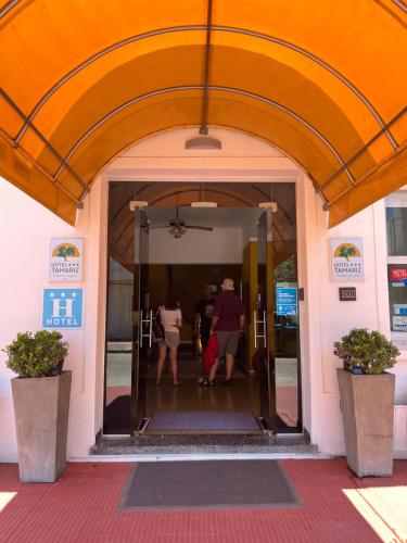 a group of people walking into a building at Hotel Tamariz in Piriápolis