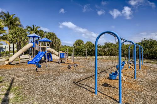 a park with a playground with a slide at Singer Island Stunner 2 BR in West Palm Beach