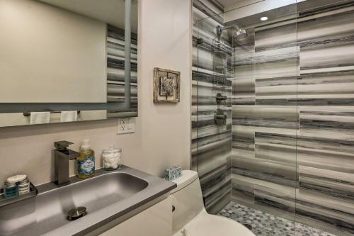 a bathroom with a sink and a toilet and a shower at Fort Lauderdale Condo with Patio, Near Canal! in Fort Lauderdale