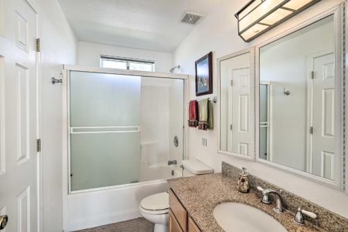 a bathroom with a sink and a toilet and a mirror at Magnificent Big River Home with Beautiful Views in Parker