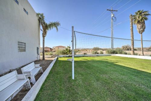 a group of benches in front of a volleyball net at Magnificent Big River Home with Beautiful Views in Parker