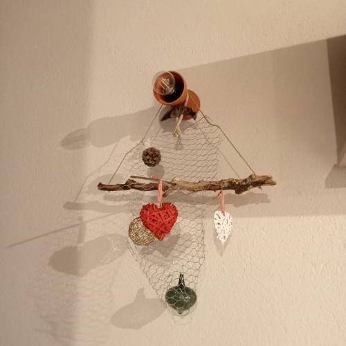 a dream catcher hanging from a ceiling at SANTINO'S HOUSE in Peveragno