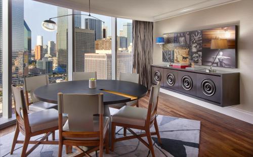 a dining room with a view of a city at Omni Dallas Hotel in Dallas