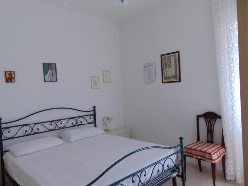 A bed or beds in a room at N019 - Numana, prestigioso quadrilocale vista mare