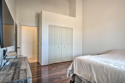 a bedroom with a bed and a wooden table at Cozy Mtn-View Vail Home with Heated Pool! in Vail
