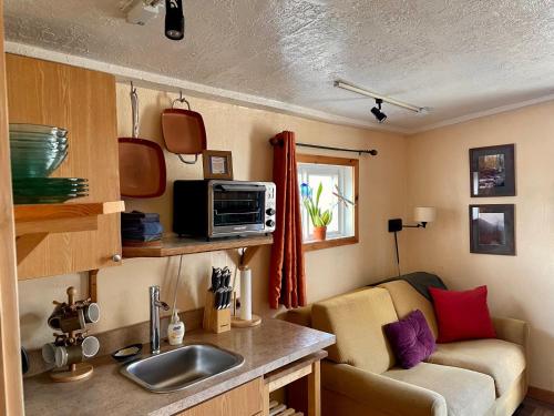 A kitchen or kitchenette at Lava Hideout Cabins