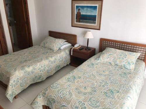 Postel nebo postele na pokoji v ubytování Apartamento Hansa Reef