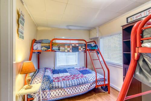 a bunk room with a bed and a ladder at Cozy Lakefront Cottage Getaway Branson MO. in Branson