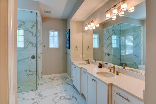 a bathroom with two sinks and a shower at Luxury Home in Downtown Sarasota, HTD POOL/Hot tub in Sarasota