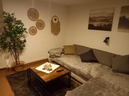 a living room with a couch and a coffee table at Fewo M & M in Scharnitz