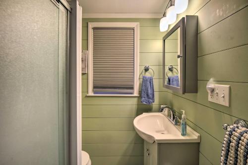a bathroom with a sink and a mirror at Updated Bristol Lakehouse with Kayaks and Beach Access in Bristol