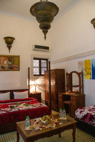 Postel nebo postele na pokoji v ubytování Riad Baba