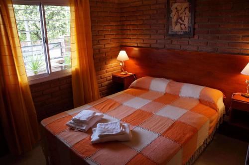 Giường trong phòng chung tại Altos del Plata