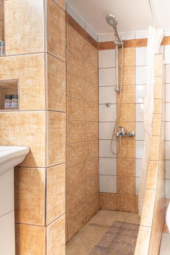 a bathroom with a shower and a sink at Boutique Apartment with ParkView in Heraklio Town