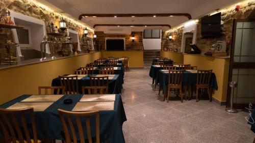 a restaurant with tables and chairs in a room at HOTEL LAFAYETTE in Tunis