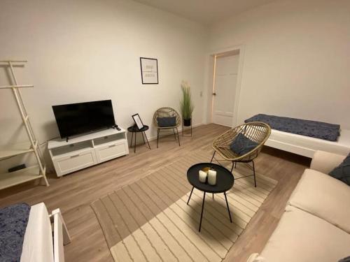 Uma área de estar em modernes cozy Apartment