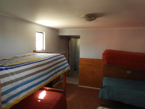 Postel nebo postele na pokoji v ubytování Hostal Ribera de Quitor