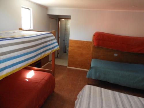 Ένα ή περισσότερα κρεβάτια σε δωμάτιο στο Hostal Ribera de Quitor