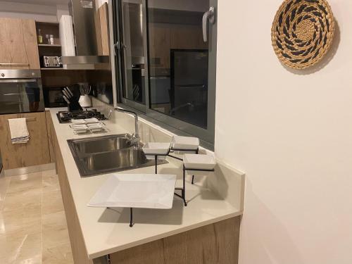 Kuchyň nebo kuchyňský kout v ubytování Beachfront penthouse - Amar'e Aparthotel & Spa