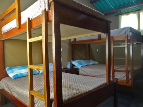 a bunk bed room with two bunk beds at The Lookout Beach Hotel in San Lorenzo