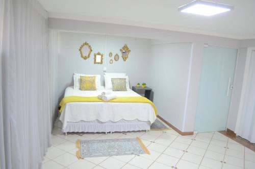 מיטה או מיטות בחדר ב-Foz Casa do Turista