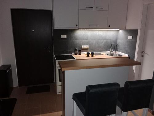 Kuchyň nebo kuchyňský kout v ubytování Apartman KLM