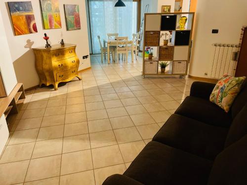 a living room with a couch and a table at Casa Vacanze Cau de Mezo in Marina Julia