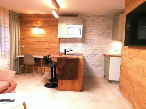 a kitchen with a wooden counter in a room at RIVER SIDE near FRANKFURT ----- STAY LIKE AT HOME ----- in Hainburg