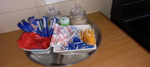 a glass bowl filled with candy on top of a table at Revive Haven Guesthouse in Roodepoort