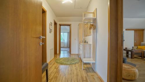 a hallway with a door leading to a living room at Vilux with indoor private parking in Braşov