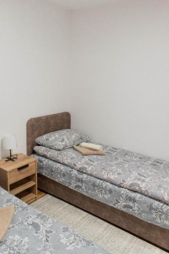 Postel nebo postele na pokoji v ubytování Vila MMBS