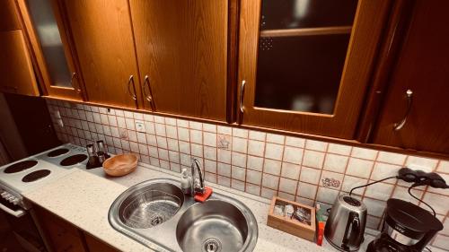 a kitchen with a sink and a counter top at CW Flat in Alexandroupoli