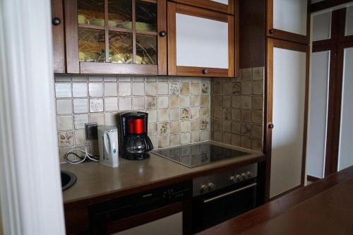 a kitchen with a coffee maker on a counter at Haus-Seehund-16 in Cuxhaven