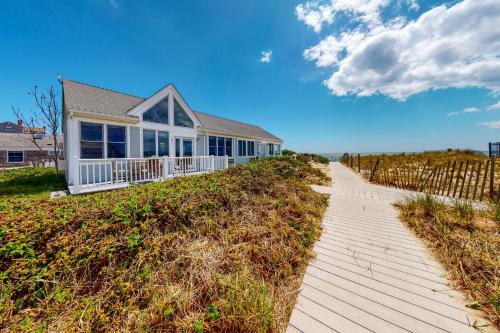 a house on top of a hill with a pathway at National Seashore Studio in Truro
