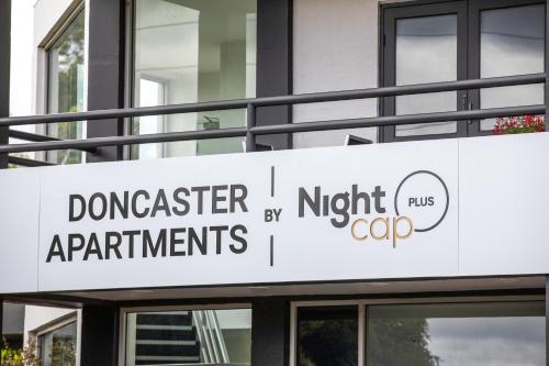 a sign on the side of a building at Nightelier Doncaster in Doncaster