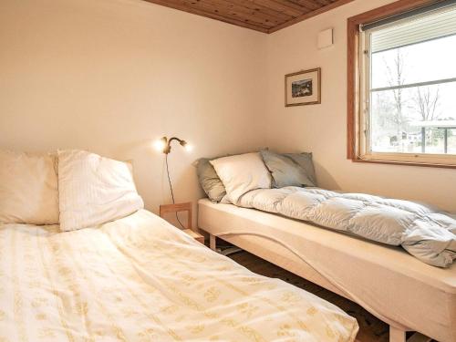 Postel nebo postele na pokoji v ubytování Modern Holiday Home in Hals with Sauna