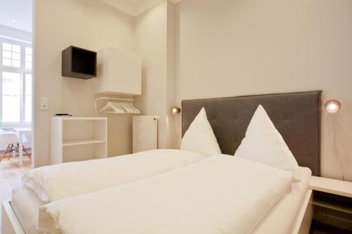 Postel nebo postele na pokoji v ubytování Soltausche Buchdruckerei - Whg 02