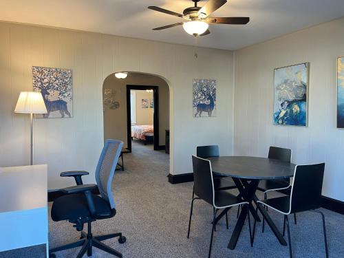 a room with a table and chairs and a bedroom at Hunter #1, Private One Bed near Xavier & Downtown in Bellevue