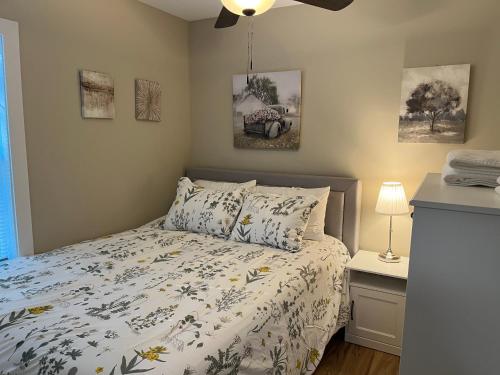 a bedroom with a bed and a ceiling fan at Wilson Two Bedroom House in Historic Loveland in Loveland