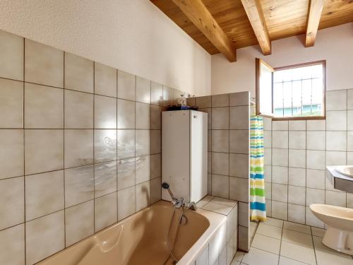a bathroom with a tub and a sink at Biscarrosse Plage: Villa 4 pièces avec terrasse, proche océan - FR-1-521-54 in Biscarrosse-Plage