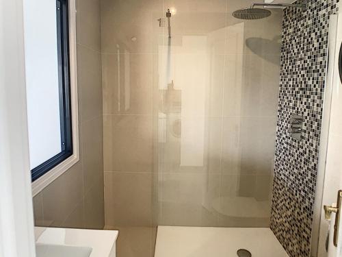 a bathroom with a shower with a glass door at Studio Cannes, 1 pièce, 2 personnes - FR-1-470-50 in Cannes
