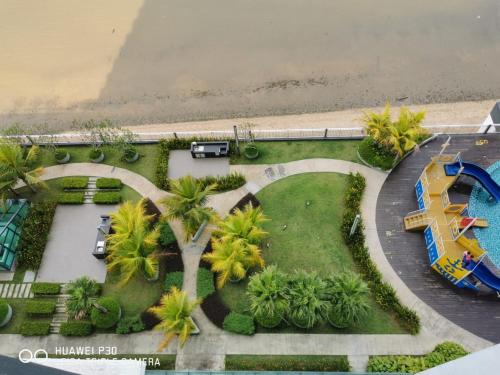 an aerial view of a water park with a roller coaster at Comfy Imperium Residence Kuantan Studio Seaview in Kuantan