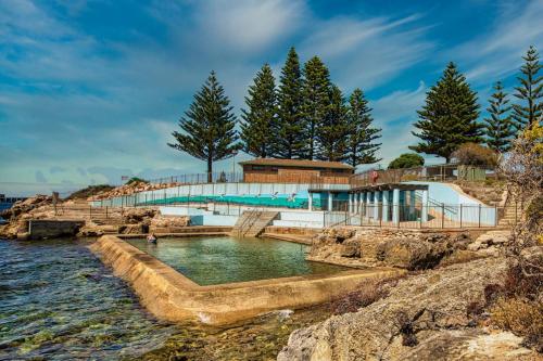 a swimming pool in the middle of a body of water at Edithburgh Caravan Park in Edithburgh