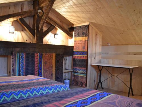 a bedroom with a bed and a wooden ceiling at Charmante maison avec jardin privatif, proche des activités nature et des vignobles de Cognac - FR-1-653-221 in Saint-Sulpice-de-Cognac