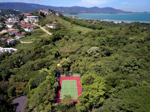 an overhead view of a tennis court on a hill at Garrya Tongsai Bay Samui in Choeng Mon Beach