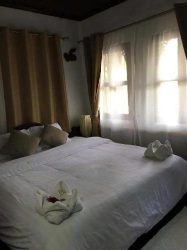 Una cama o camas en una habitación de View Khemkhong Guesthouse