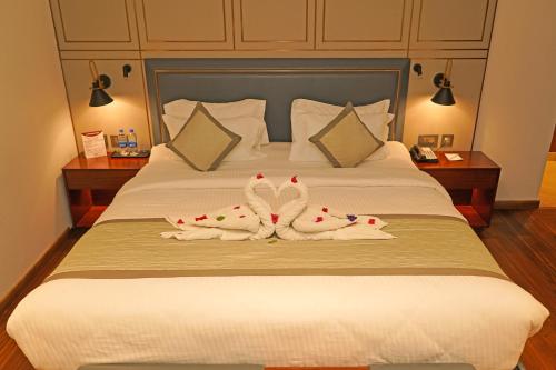 Ένα ή περισσότερα κρεβάτια σε δωμάτιο στο Pride Hotel Udaipur