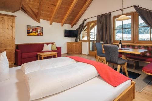 Postel nebo postele na pokoji v ubytování Hotel Garni am Sonnberg
