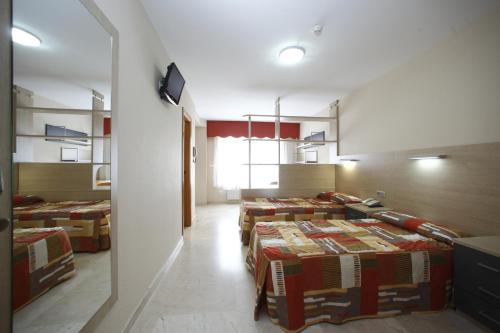 Ліжко або ліжка в номері Hotel Rialta